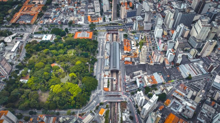 Aerial shot of São Paulo cityscape showcasing dense urban architecture and a green park.