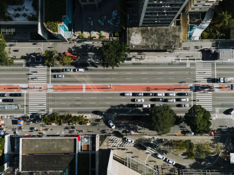 Aerial shot of Avenida Paulista in São Paulo showing bustling city life and traffic.