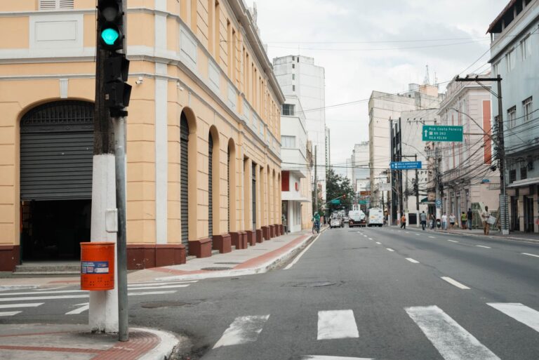 Urban street scene in Vitória shows historic buildings and vibrant city life.